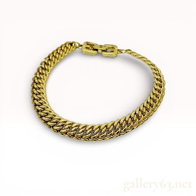 Vintage Givenchy Gold-Tone Double Curb Link Bracelet. This designer bracelet by Givenchy is 