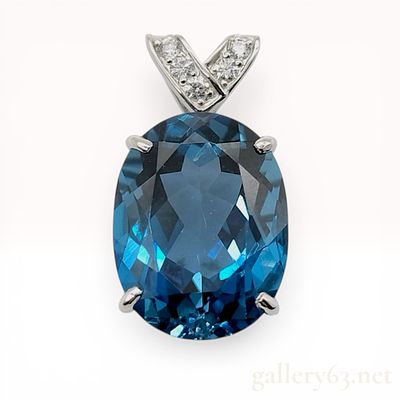 Platinum London Blue Topaz and Diamond Pendant. Large oval-cut London Blue Topaz and diamond 