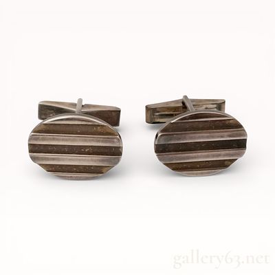 A Pair of Tiffany & Co. Sterling Silver Ribbed Oval Cufflinks, 1995. Tiffany &amp; Co. sterling 