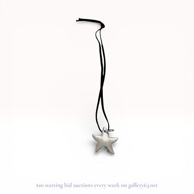 Tous Sterling Silver Starfish Pendant on Black Cord Necklace. A sterling silver starfish pendant 