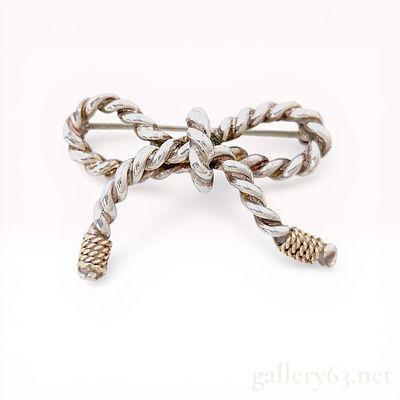 Tiffany and Co. Sterling Silver and 18K Yellow Gold Twisted Rope Bow Brooch. Tiffany and Co. 
