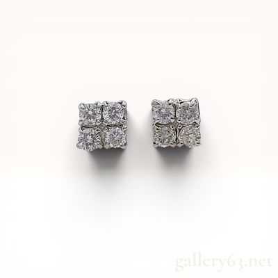 A Pair of Diamond and .900 Platinum Cluster Stud Earrings. A matched pair of diamond cluster 