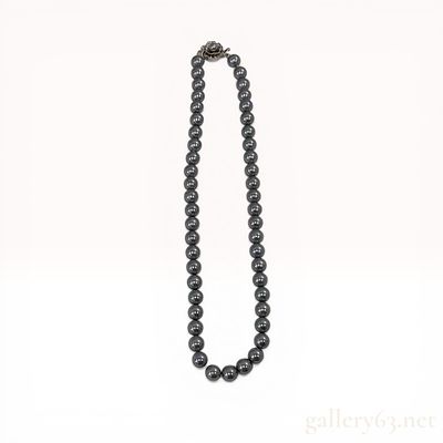 A Set of Dark Grey Pearl Jewelry Including a Necklace and Matching Earrings. Jewelry set 