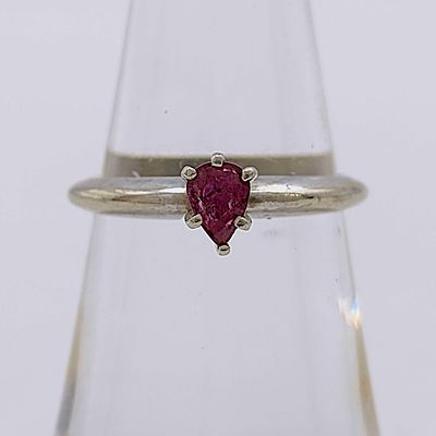 14 Karat White Gold Pear-Cut Ruby Solitaire Ring. 14 karat white gold solitaire ring featuring a 