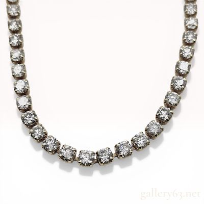 18K Yellow Gold and 10.00ctw Natural Diamond Tennis Necklace. An 18 karat yellow gold diamond 