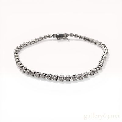 Platinum and 3.00ctw Natural Diamond Tennis Bracelet. Platinum tennis bracelet featuring a 
