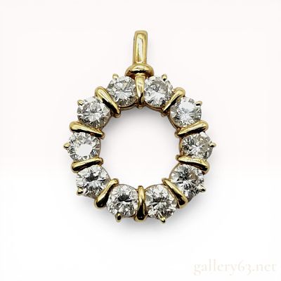 18K Yellow Gold 2.44ctw Diamond Circle Pendant. 18 karat yellow gold circle pendant featuring 