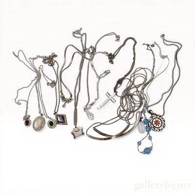 An Assortment of Silver and Silver-Tone Costume Jewelry Necklaces and Pendants Including Lowrys Farm