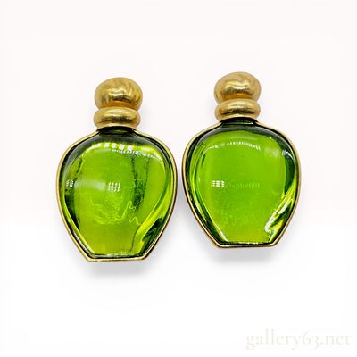 A Pair of Christian Dior Tendre Poison Perfume Bottle Brooches. Christian Dior pair of gold-tone 