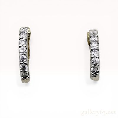A Pair of Platinum 18K Yellow Gold and Diamond Huggie Hoop Earrings. A matched pair of two-tone 