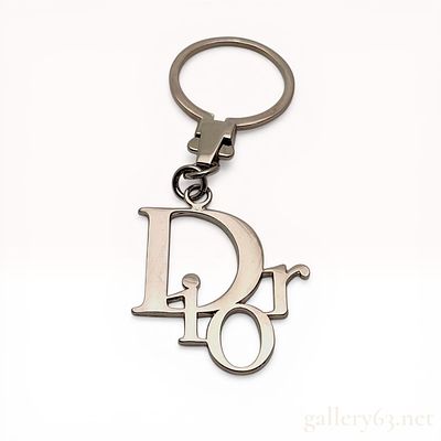 Christian Dior Silver-Tone Logo Keychain with Presentation Box. Christian Dior silver-tone logo 