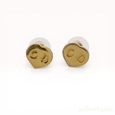A Pair of Christian Dior Gold-Tone CD Heart Stud Earrings. Christian Dior gold-tone heart-shaped 