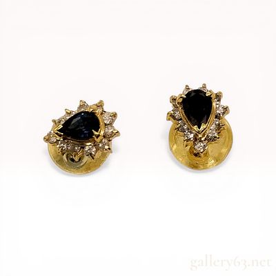 A Pair of 18K Yellow Gold, Sapphire, and Diamond Halo Stud Earrings. A pair of 18-karat yellow 
