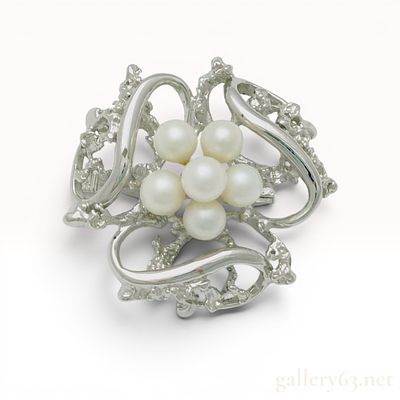 Cultured Pearl and Sterling Silver Floral Brooch. Mid-20th century cultured pearl and silver 