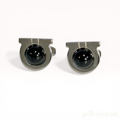 A Pair of Salvatore Ferragamo Silver-Tone Gancini Onyx Cabochon Cufflinks. A pair of Salvatore 