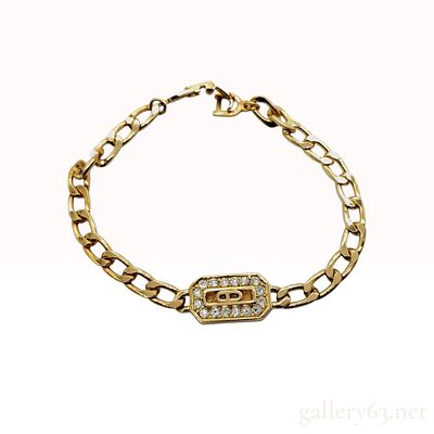 Christian Dior Gold-Toned Curb Link Bracelet with Crystal Logo Station. Christian Dior 