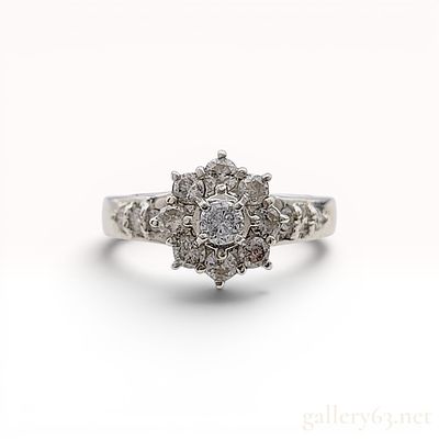 Platinum and Diamond Flower Cluster Ring. Platinum floral cluster ring featuring fifteen round 