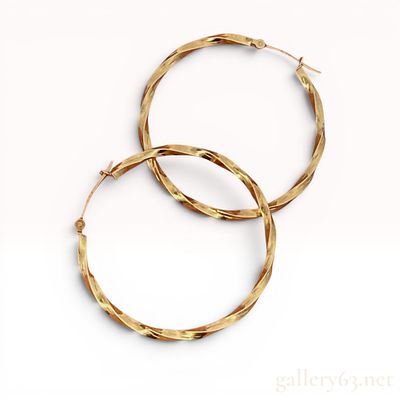 A Pair of Italian 10K Yellow Gold Twisted Hoop Earrings. A matched pair of 10-karat yellow gold 