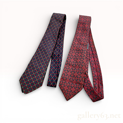 Two Hermes Silk Neckties. Two Hermes silk neckties. The first is a navy blue silk tie featuring 