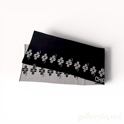 Chanel Boutique Reversible Black and White Knit Clover Motif Scarf. Chanel reversible knit scarf 