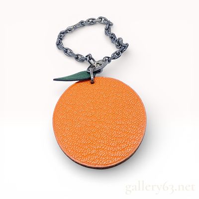 Hermes Orange Fruit Bag Charm, Grained Leather and Sterling Silver. This authentic Herm&egrave;s bag 