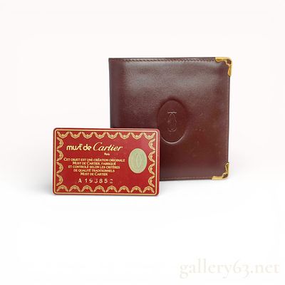 Must de Cartier Burgundy Leather Bifold Wallet. This Must de Cartier bifold wallet is 