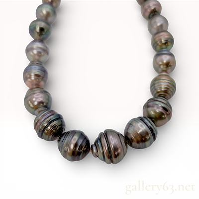 Black Butterfly Pearl Necklace. Authentic pearl necklace made from a single strand of dark 