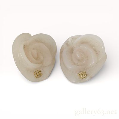 Chanel Camellia Plastic Clip-On Earrings. Authentic Chanel camellia motif earrings formed in 