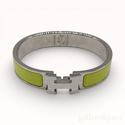Hermes Clic H bracelet in citron yellow enamel and palladium-plated metal. Authentic Herm&egrave;s 