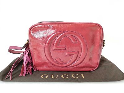 Gucci Soho Disco Bag in Pink Patent Leather. A Gucci Soho Disco crossbody bag crafted from 