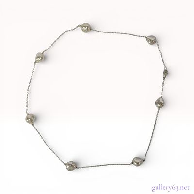 Silver-Tone Organic Bean Station Necklace. A silver-tone metal station necklace featuring a 