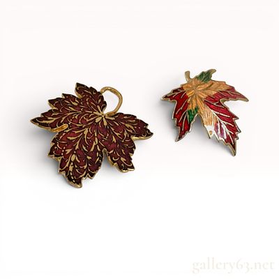 Two Metropolitan Museum of Art MMA Gold-Tone and Enamel Maple Leaf Brooches. Two Metropolitan 