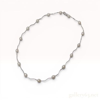 Sterling Silver and Freshwater Pearl Wavy Station Necklace. Modern sterling silver station 