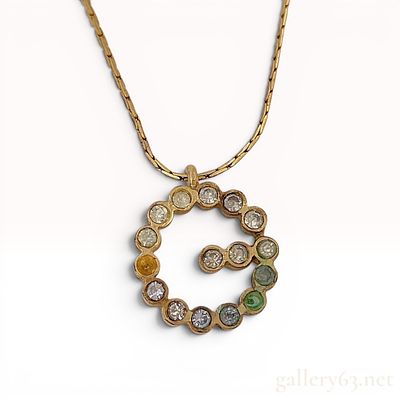 Givenchy Gold-Toned Rhinestone Logo Pendant Bracelet. Vintage Givenchy gold-toned base metal 