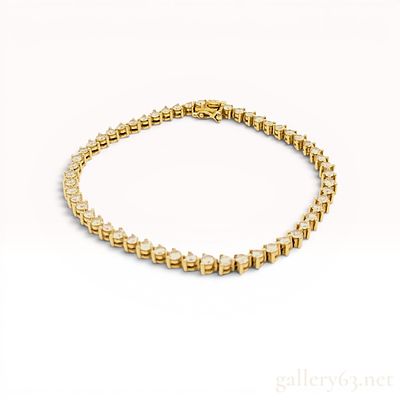 An 18 Karat Yellow Gold and 3.10ctw Diamond Tennis Bracelet w/Box. An 18 karat yellow gold 