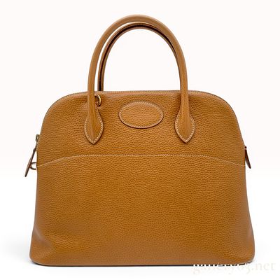 Herm&egrave;s Gold Clemence Leather Bolide Handbag with Gold-Tone Hardware. A Herm&egrave;s Bolide handbag 