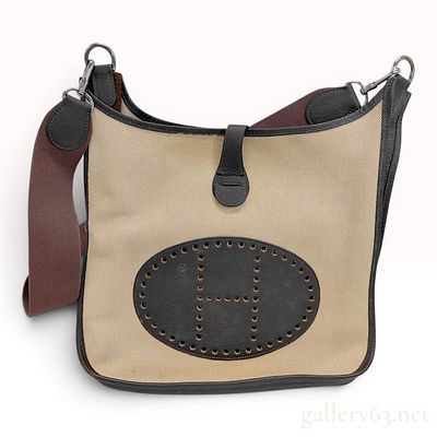 Herm&egrave;s Evelyne PM Toile and Grained Leather Crossbody Bag. An Herm&egrave;s Evelyne PM crossbody 