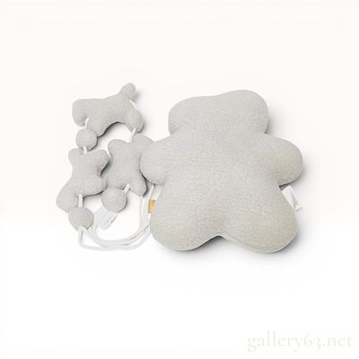 A Pair of Hermes Baby Plush Toys. Hermes. This pair of infant toys comprises a large bear-shaped 