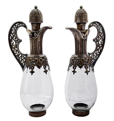 A pair of 1869 Victorian silver and glass jugs made by Alexander Macrae London, decorated with 