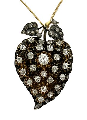 An antique pendant made of gold combined with silver in a special design set 