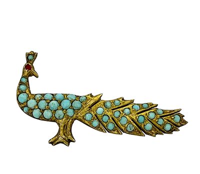 Antique gold brooch in the shape of a peacock inlaid with turquoise gems. 
Very beautiful 