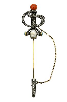 An antique gold and silver brooch, with a unique sword-like design, set with 