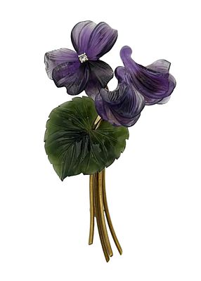 An antique gold brooch with a special flower-and-leaf design, set with 