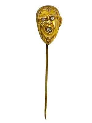 Yellow gold brooch in the form of an angry man's face set with diamonds. Very beautiful 