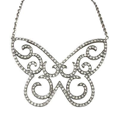 A white gold chain and pendant with a special design resembling a large and 