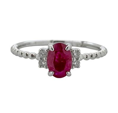 A 14K white gold ring set with white diamonds and a central ruby gemstone that weighs 0.50ct