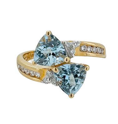 A 14K gold ring with a special design set with white diamonds and gemstones, the weight of the