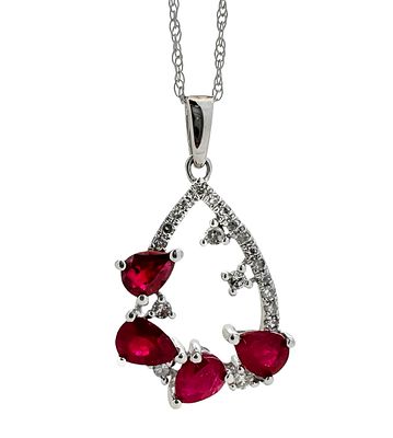 A 14K gold pendant and necklace set with white diamonds and ruby gemstones with a total weight
