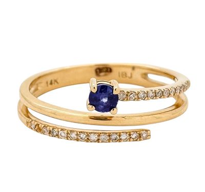 A 14K yellow gold ring with a special design set with white diamonds and a sapphire gemstone