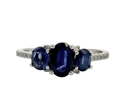 A 14K white gold ring set with white diamonds and sapphires, The diamonds set in the setting